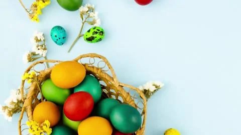 Painted eggs in a festive basket decor in various colors Stock Footage 165881736