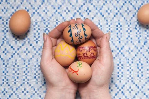 Painted eggs on hand Stock-Fotos