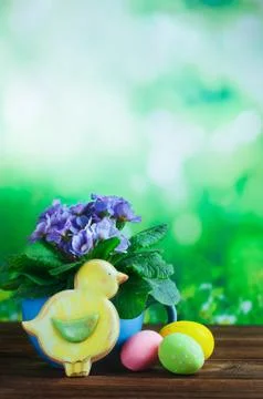 Painted eggs in small buckets, Easter bird gingerbread and primrose flower on Stock Photos