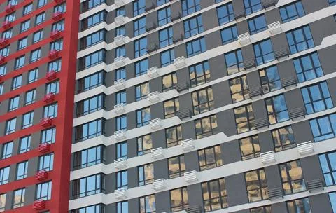 Painted Gray and Red Facade Of Modern Apartment House Stock Photos