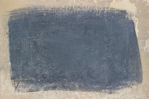 Painted gray rectangle on a beige concrete surface. Stock Photos