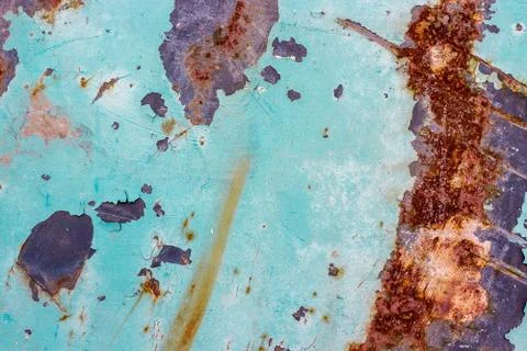 Painted iron background with a large rusty spot and metal corrosion. Stock Photos