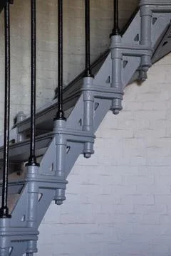 Painted iron steps inside lighthous seen from side. Foto stock
