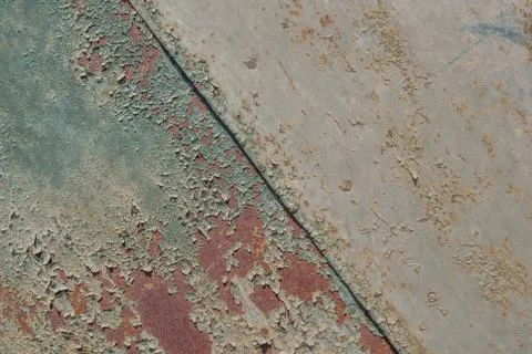 Painted iron surface with a large rusty and metal corrosion, chipped paint Stock Photos