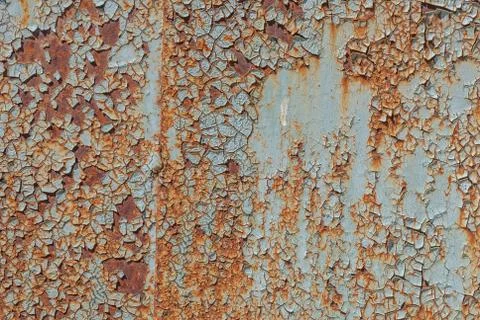 Painted iron surface with a large rusty and metal corrosion, chipped paint Stock Photos