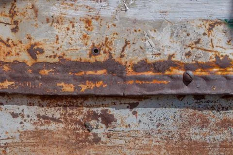 Painted iron surface with a large rusty and metal corrosion, old background Stock Photos