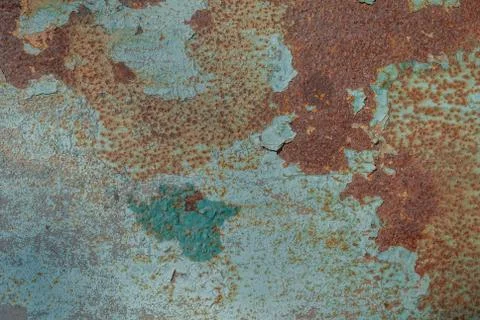Painted iron surface with a large rusty and metal corrosion, chipped paint Stock Photos