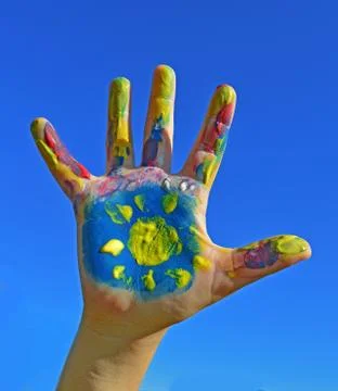 Painted kid hand Stock Photos