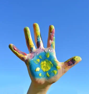 Painted kid hand Stock Photos