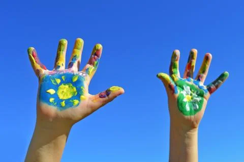 Painted kid hands Stock Photos