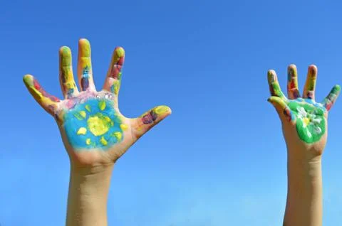 Painted kid hands Stock Photos