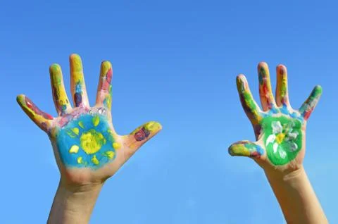 Painted kid hands Stock Photos