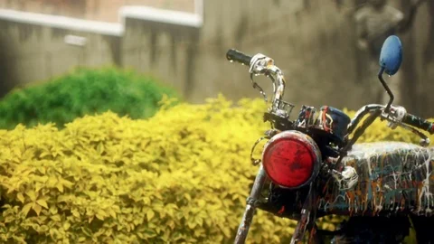 Painted motorcycle in the rain Stock Footage 82305340