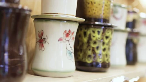 Painted mugs on store shelf. Video stock 305370607