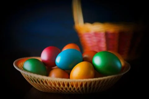 Painted multi-colored paint Easter eggs with a basket Stock Photos