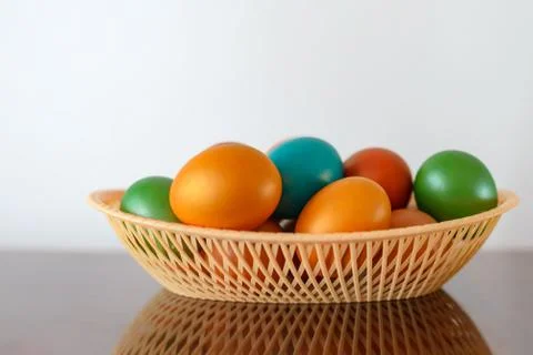 Painted multi-colored paint Easter eggs with a basket Stock Photos
