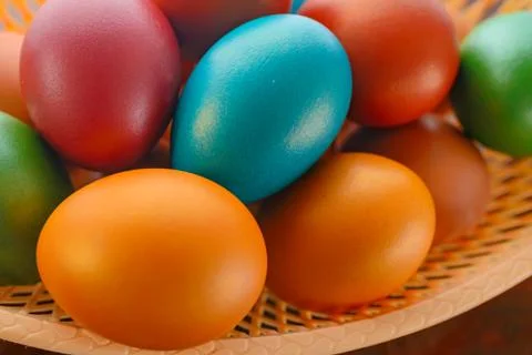 Painted multi-colored paint Easter eggs with a basket Stock Photos