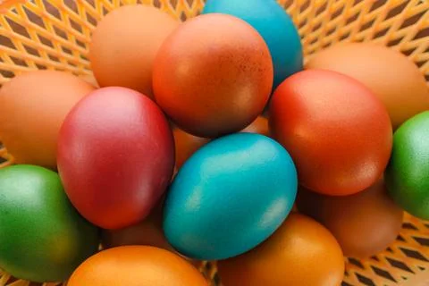 Painted multi-colored paint Easter eggs with a basket Stock Photos