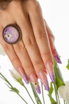 Painted nails and hands isolated on white background with flowers Stock Photos