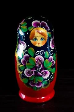 Painted nesting doll on a dark background Stock Photos