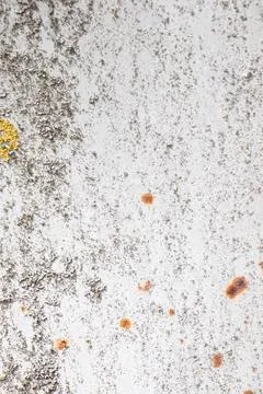 Painted old metal surface with rust appearing. The texture of painted metal. Stock Photos