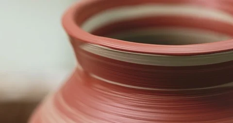 Painted pot rotating on pottery wheel. Just painted with brush Stock Footage 120712318