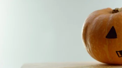 Painted pumpkin, camera moves from left to the right, white background Stock Footage 108561128