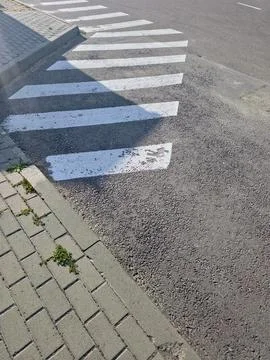 Painted Road Markings Create a Visual Guide for Pedestrians at the Crosswalk Stock Photos