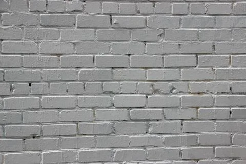 Painted into solid grey stylish grunge brick wall background texture 库存照片