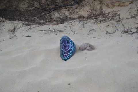 Painted stone on the beach Foto stock