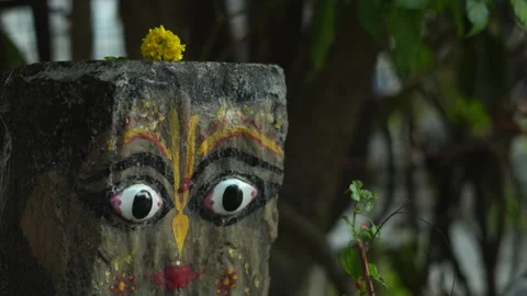 Painted Stone Face Inspired by Hindu God Stock Footage 321025501