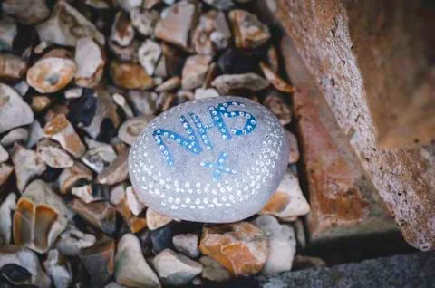 Painted stone supporting the nhs 写真素材