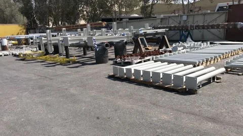 Painted structural steel items kept in direct sun for drying Stock Footage 170368356