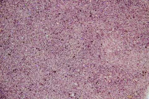 A painted sugar with glitter inside. Nice texture and background from sand wi Stock Photos