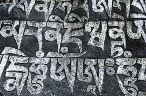 Painted Tibetan Script Carved Stone Stock Photos