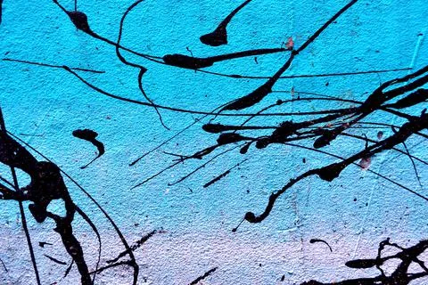 Painted wall abstract background. Black paints on blue background Stock Photos