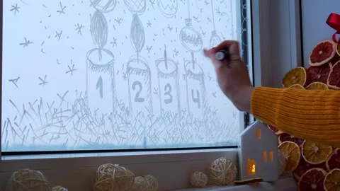 Painted window with white marker. Christmas advent candles decoration on big Stock Footage 310926214