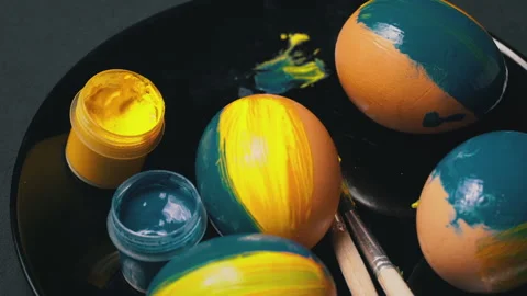 Painted Yellow-Blue Easter Eggs are Spinning Stock Footage 171346889