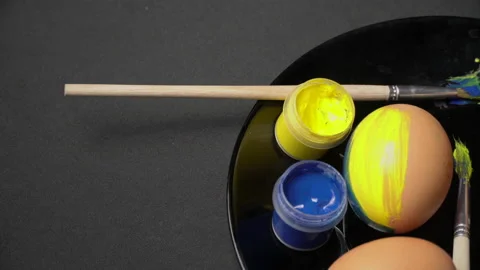 Painted Yellow-Blue Easter Eggs are Spinning Stock Footage 171524102