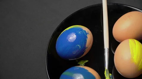 Painted Yellow-Blue Easter Eggs are Spinning Stock Footage 171546593