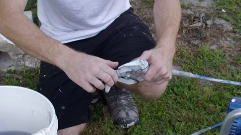 Painter Adjusts Nozzle Before Spraying House Stock Footage 95483655