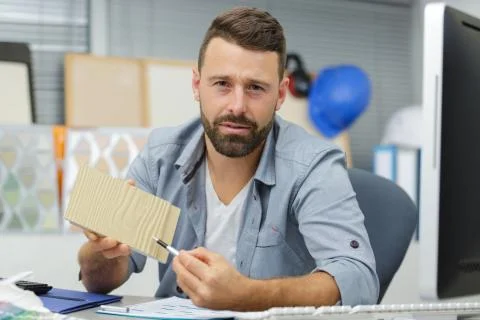 Painter and decorator shows sample to customers Stock Photos