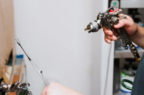 The painter applies paint to the part sample Stock Photos