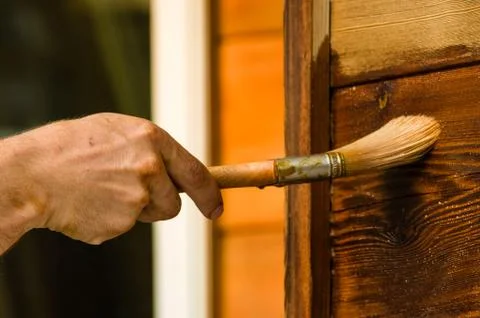 Painter applying finish to wall Stock Photos