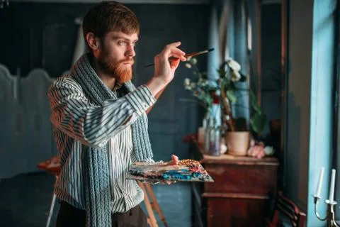 Painter with brush in hand selective focus Stock Photos