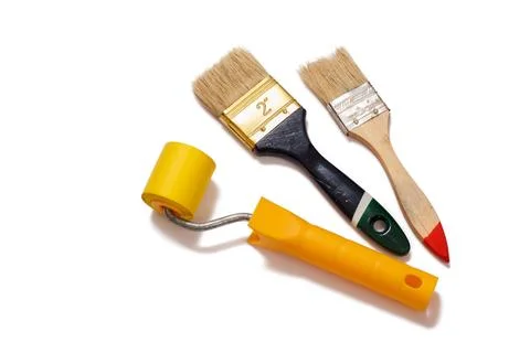 Painter brushes and roller on a white isolated background. Repair tool. Stock Photos