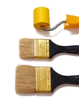 Painter brushes and roller on a white isolated background. Repair tool. Stock Photos