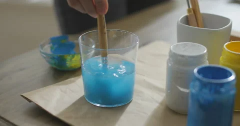 Painter cleaning a brush with water Stock Footage 151163887