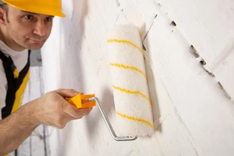 Painter on a construction site while doing his job. Foto stock