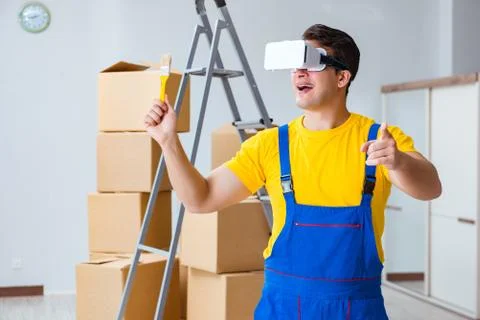 Painter contractor working with virtual reality goggles 写真素材